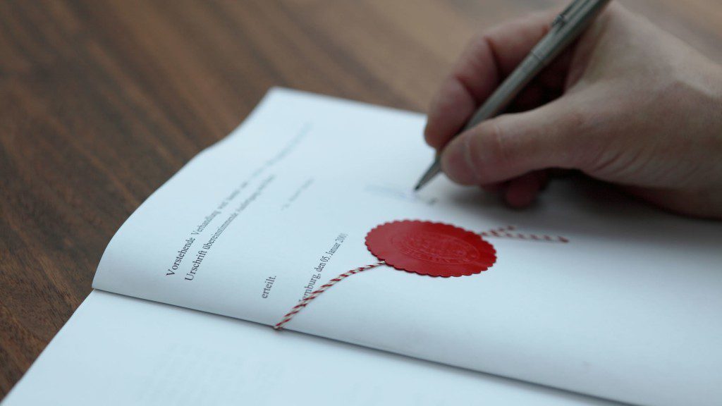 paper with notary seal and pan signing